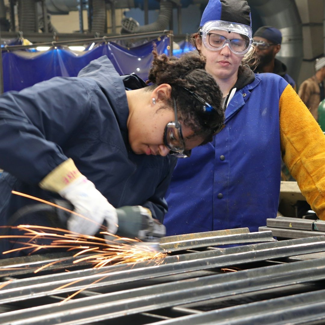 Trainees learning in a workshop
